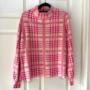 Pink and cream sweater. Very soft. Good condition
